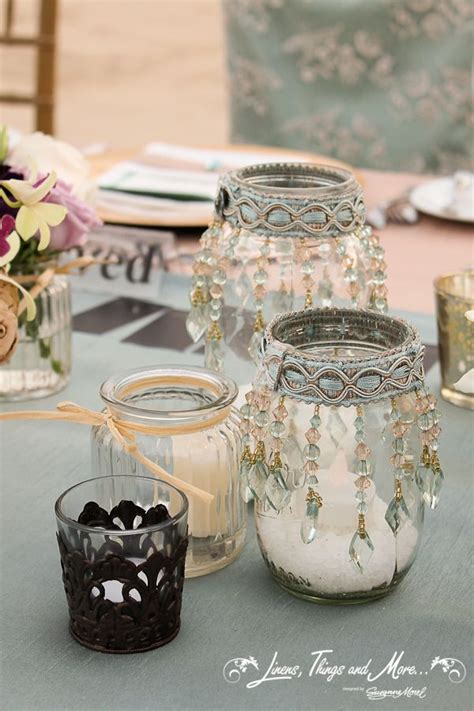 The right lighting at a wedding reception can really bring out that wow factor, and mason jars work perfectly as candle holders and lanterns. DIY - Aqua blue, lace, champagne and Mason Jars wedding ...