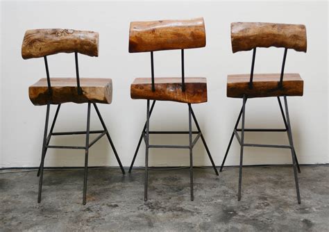 It's an ideal piece to add a rustic yet modern touch to your home kitchen bar or restaurant. Rustic Modern Iron and Log Bar Stools at 1stdibs