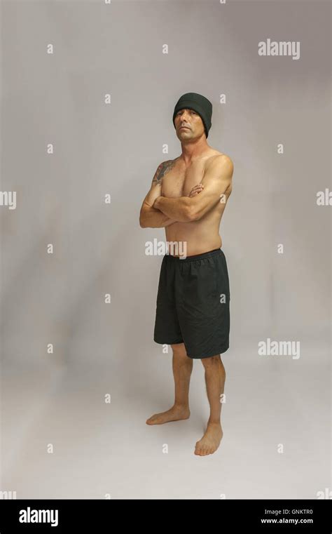 Shirtless Middle Age Man Showing Crossed Arm Tough Guy Pose Stock Photo