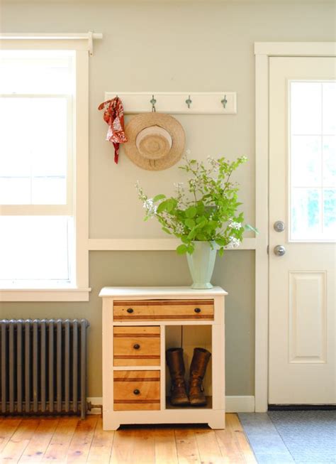 It's a fun way to bring life into an otherwise neutral room. refinished shoe cabinet, two toned walls, wall hooks ...