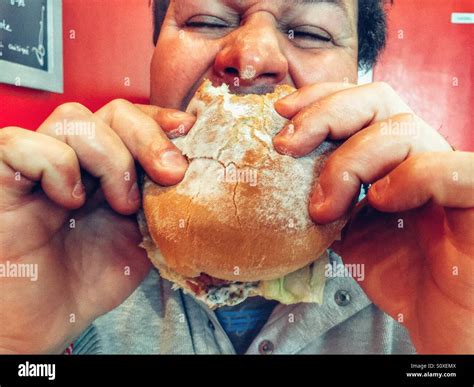Man Eating Burger Stock Photo Alamy