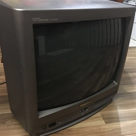 An Old Television Set Sitting On The Floor