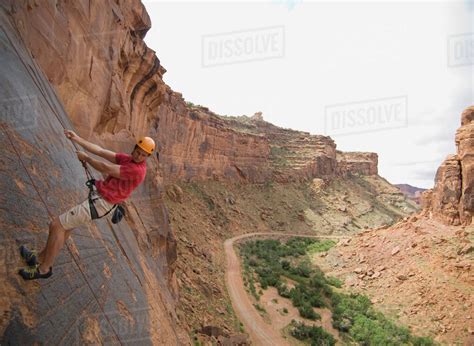 Man Rock Climbing Stock Photo Dissolve