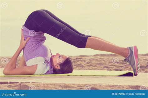Young Girl Doing Yoga Poses Sitting On Sunny Beach Stock Image Image