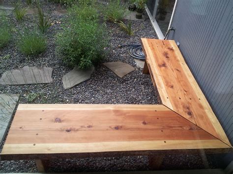 Woodworking plans for a corner bench made of scaffolding wood. Outdoor Corner Bench - HomesFeed