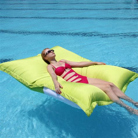 these bean bag pool floats are like laying on a giant pillow in the water