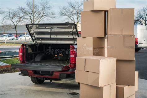 Moving Boxes Ready To Be Loaded Into The Pickup Truck Stock Photo