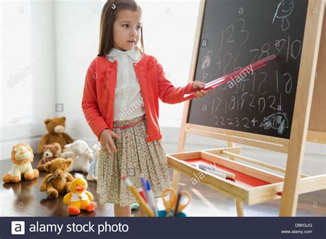 Girl Pretending To Be Teacher Stock Photo Alamy