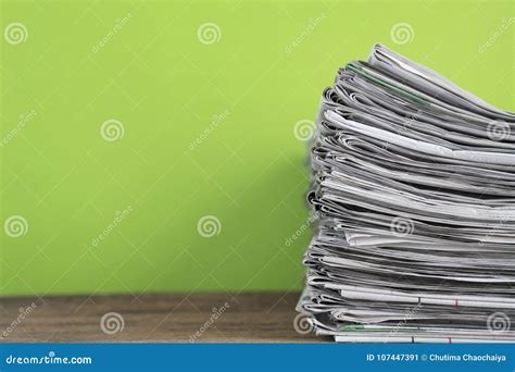 Newspapers Folded And Stacked Background On The Table Stock Image