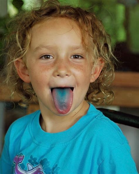 Girl With Blue Tongue Photograph By Norman Johnson