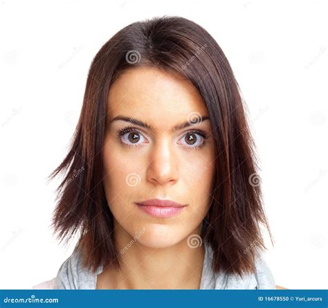 Stock Photo: Beautiful young woman staring at you against white. Image