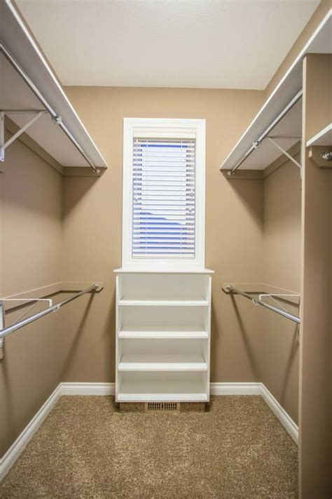 We're now moving on to changing the old bathroom. Two full walls of rods in this walk in closet with a ...