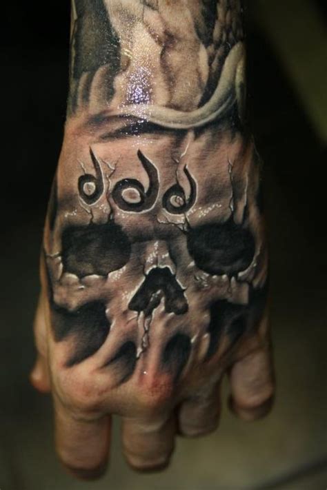 35 Awesome Skull Tattoo Designs Inspiration Hand Tattoos For Guys Skull Hand Tattoo Hand