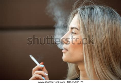 Young Pretty Girl Smokes Cigarette Street Stock Photo 1067540189