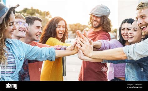 Young Friends Stacking Hands Outdoor Happy Millennial People Having