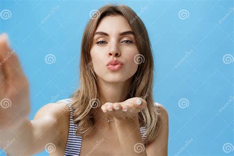 Close Up Shot Of Self Assured Glamorous And Attractive Stylish Woman Holding Hand Near Folded