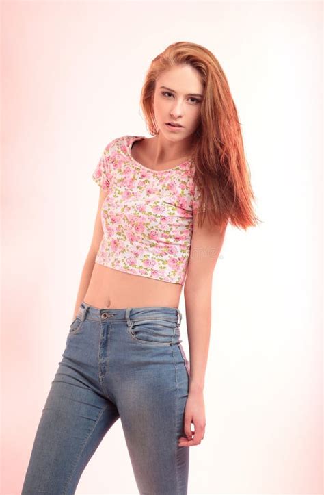 modern girl in jeans posing in front of the camera stock image image of elegance copyspace