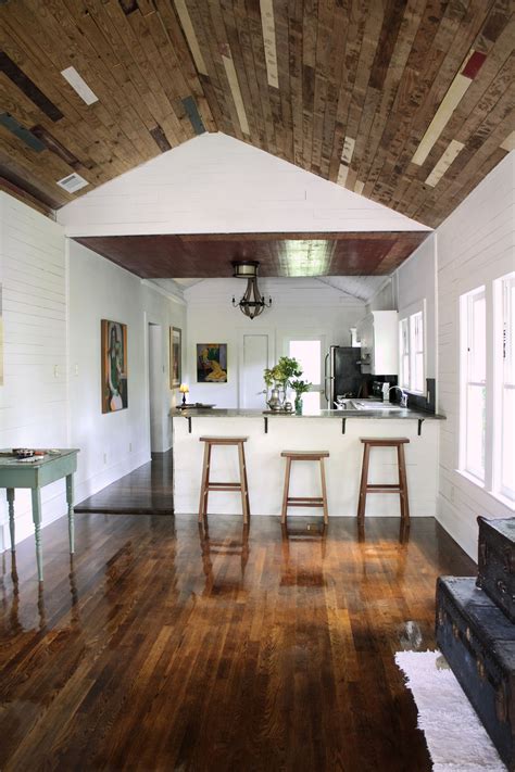 Shiplap walls and ceiling kitchen. Reclaimed wood ceiling above a poured concrete countertop ...