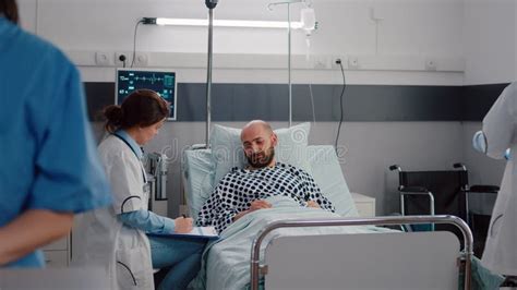 Medical Practitioner Doctors Examining Sick Man Checking Sickness