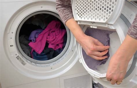 Fortunately, most are fixed with some simple adjustments Woman Taking the lent of Dryer - Bayside Appliance Repairs