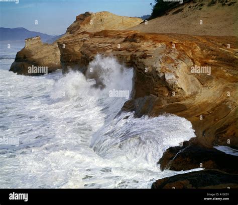 Huge Pacific Ocean Waves Crash Onto The Sandstone Cliffs At Cape