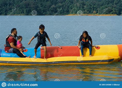 The kenyir lake, bold in its kenyir lake, a malaysian's pride of ecotourism is located in the state of terengganu, is capable of catering to younger crowds, there's also the kenyir water park, a small theme park with slides, obstacle. People Enjoying Water Activities On Banana Boat At The ...