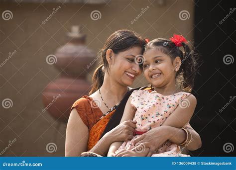 portrait of loving indian mother and daughter at village royalty free stock image