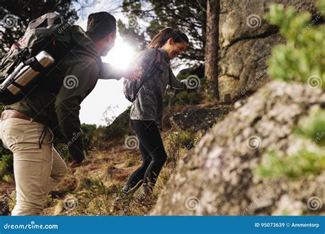 Happy Young Couple Hiking Together In Mountain Stock Image Image Of