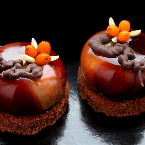 Dark Brown Glazed Desserts With Fresh Buckthorn Berries And Almonds On