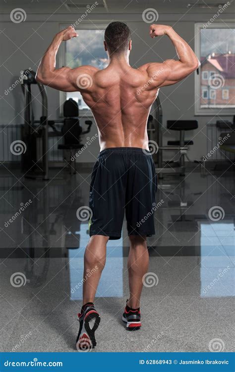 Bodybuilder Performing Rear Double Biceps Pose Stock Image Image Of