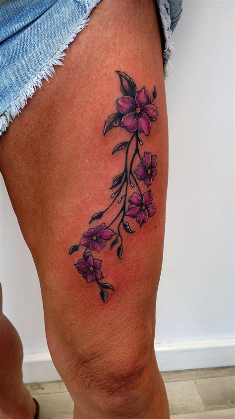 Vine tattoos are great for creativity of both the wearer and the artist. Flower vine on the thigh by Dave. #flowers #thigh #tattoo ...