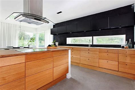 Wooden kitchen cabinets are made more modern with white countertops and cabinet doors. {BLACK. WHITE. YELLOW.}: Black and Wood Modern Kitchen...