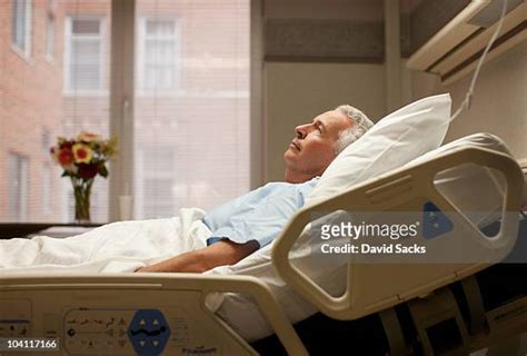Old Man Laying In Hospital Bed Photos And Premium High Res Pictures