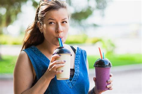 Premium Photo Thirsty Woman Drink Fresh Tasty Smoothie Outdoors Delicious Milk Shake Young