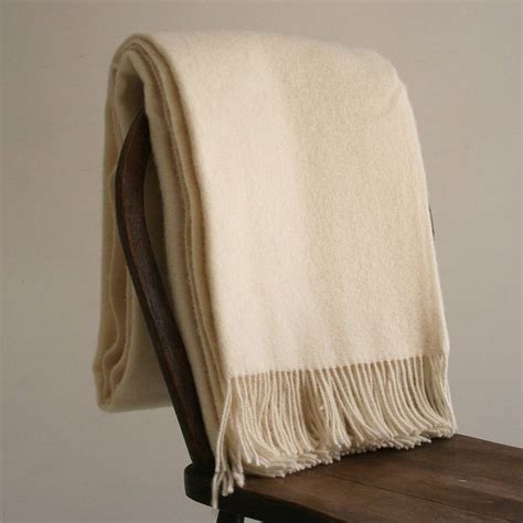 Set a neutral foundation in your home with this area rug. natural cream pure wool throw by pebble & chalk ...