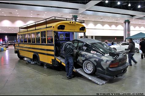 School Bus With Drawbridge Cutout In Rear To Haul The Car While It Tows