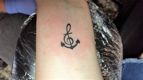 Combined Treble Clef And Anchor Tattoo