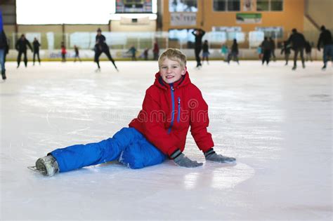 Schoolboy Having Fun On Ice Skating Rink Stock Photo Image Of Holiday