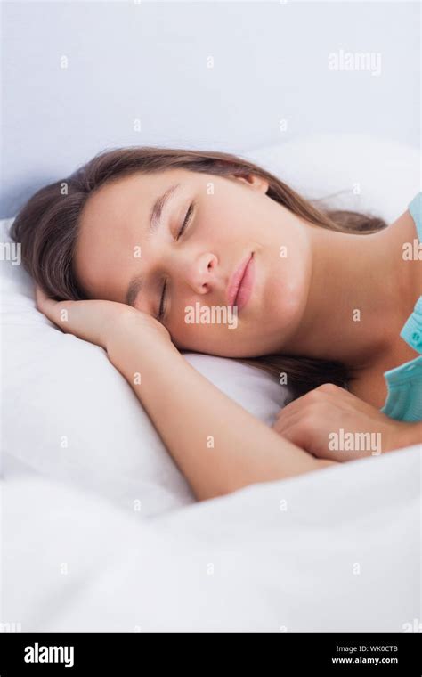 Brunette Woman Asleep In Bed Stock Photo Alamy