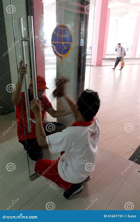 A Cleaning Service Worker Inside The Passenger Car Of The Jakarta Subway Editorial Image