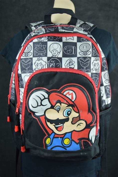 Super Mario Bros 16 School Backpack Multi Pocket Black Red White See