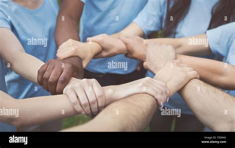 Hands Of Young People Joined In Circle Stock Photo Alamy