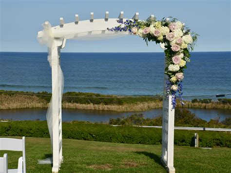 Reverie vp image source circular seating so everyone can see. asymmetrical arbor flowers and the sea | Outdoor wedding ...