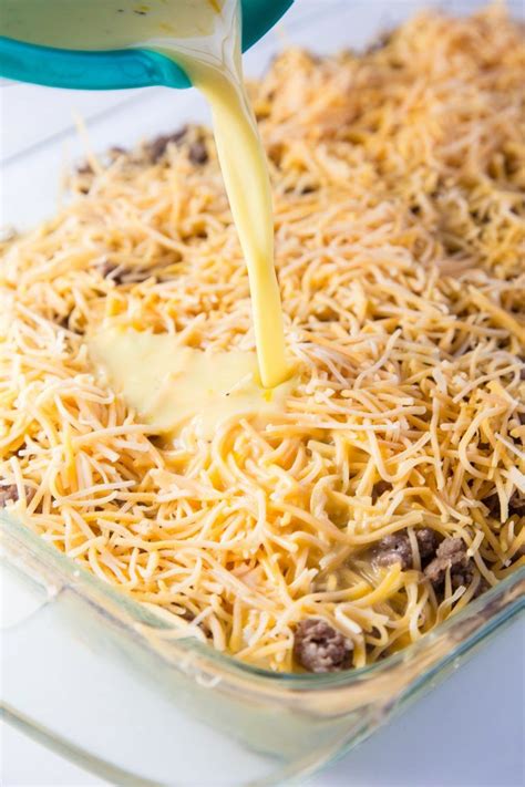 Drop an egg into each hole. Overnight Cheesy Sausage and Hashbrown Breakfast Casserole Recip… | Hashbrown breakfast ...