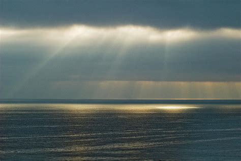 Evening Sun Rays Over The Pacific Ocean Photograph By Lacey Ann Johnson