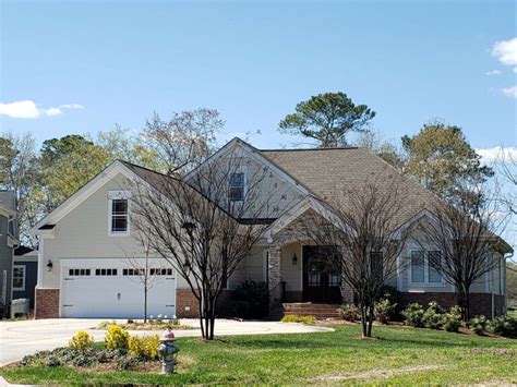 Lifetime, limited transferable warranty with 10 year sure start protection. GC_1_From Slight Right_GAF Timberline Natural Shadow Weathered Wood - Andrews Roofing