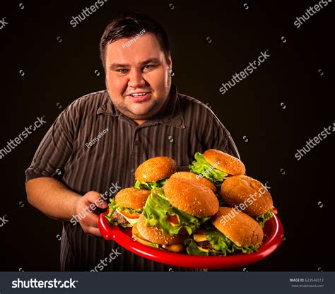 Fat Man Eating Fast Food Hamberger Stock Photo Edit Now 623546513