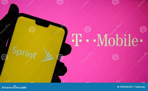 Sprint And T Mobile Logos On The Screens Of Mobile Devices Concept For