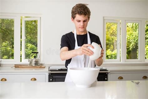 A Teenage Boy Cooking In A Kitchen Stock Image Image Of Bowl