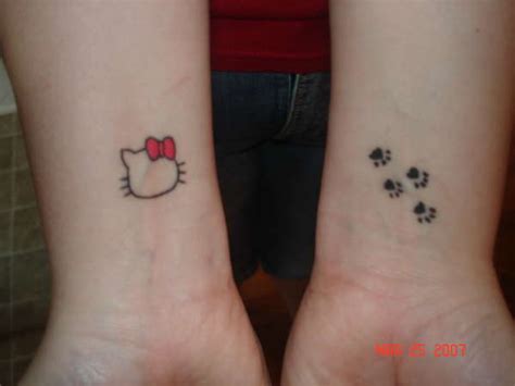 Hello Kitty Bow Tattoos On Finger